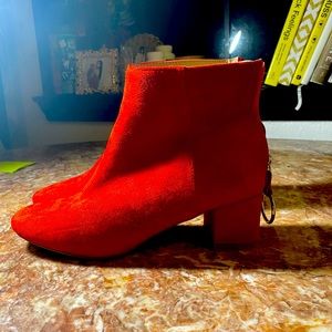 Red booties with silver ring zipper